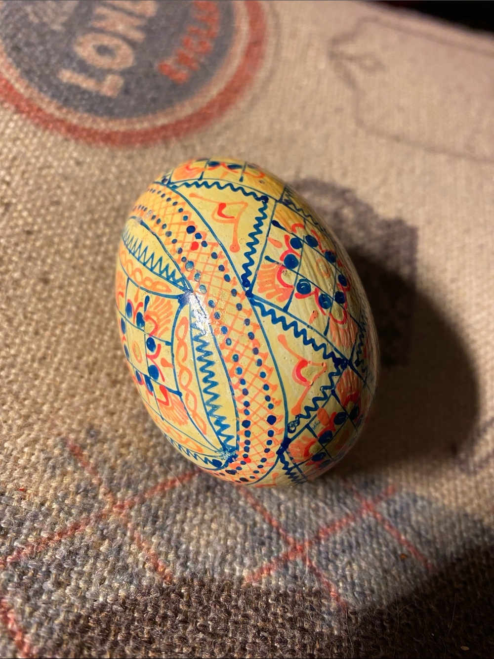 Hand-Painted Decorative Wooden Egg with Geometric Patterns